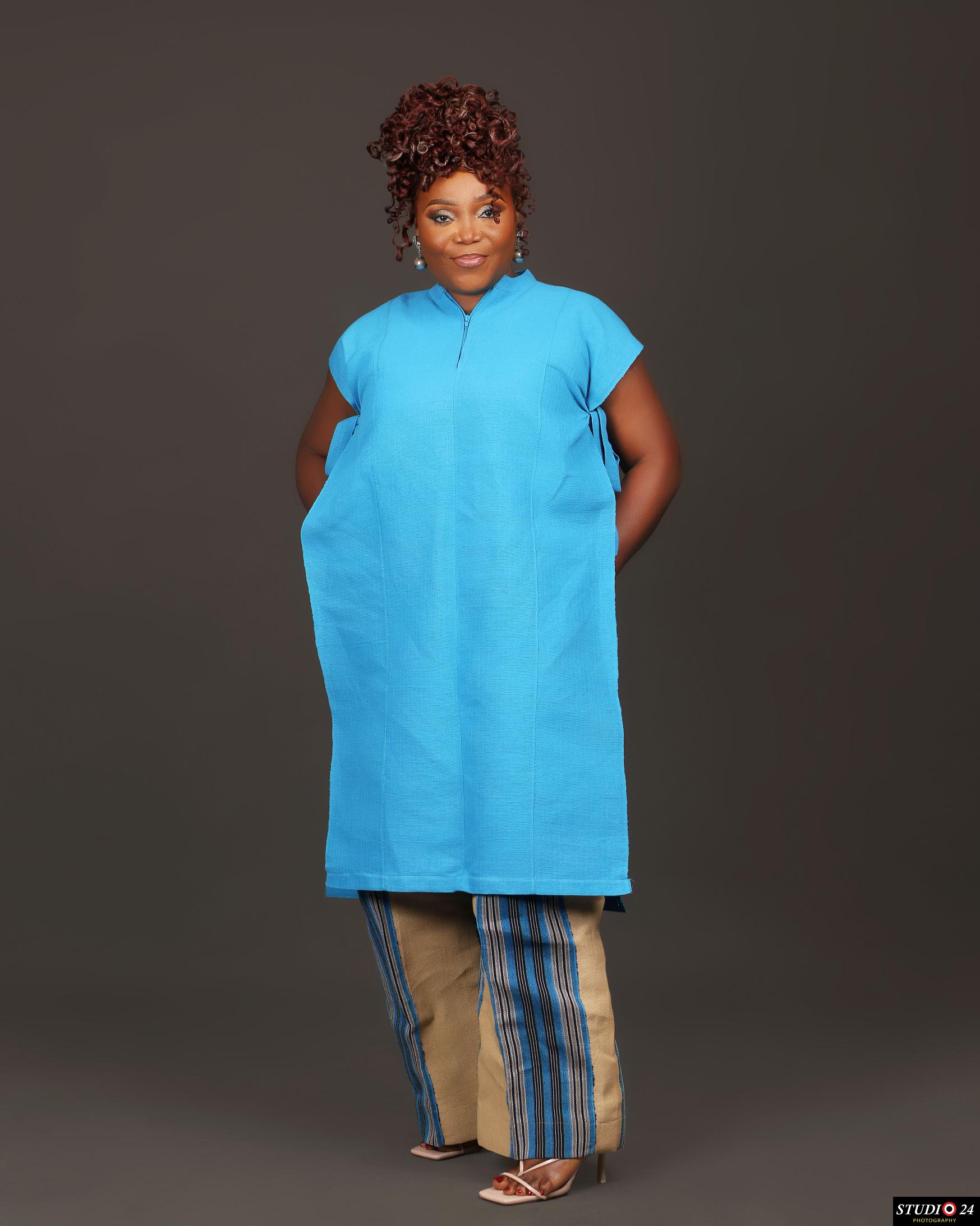 Full length studio portrait of Temitope in blue